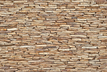 Plaster on a yellow wall. Concrete wall texture close up.