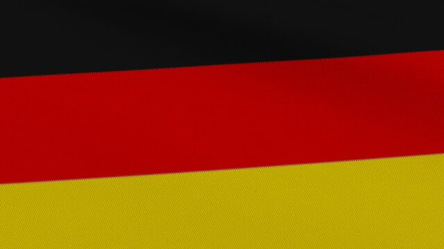 Flag of Germany with horizontal black, red and gold stripes waving in the wind