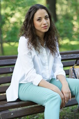 Portrait of a young beautiful girl in the park