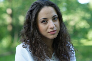 Portrait of a young beautiful girl in the park