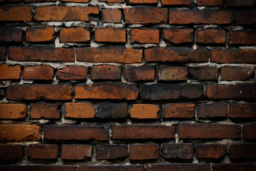 Naklejka premium Brick wall red old weathered texture background. Grunge old house aged dark bricks.