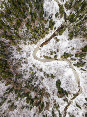 Aerial view of winding river and forest in Riezupe river nature park in winter day, Latvia. 