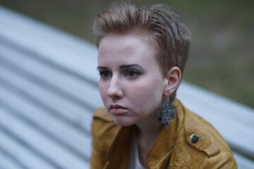 Portrait of a young beautiful girl in the park