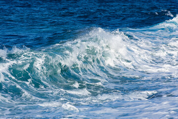 Stormy sea with foamy waves on a sunny day