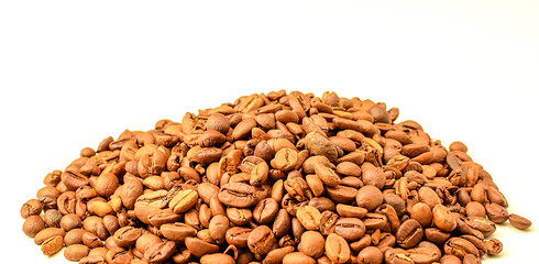 Fragrant roasted coffee beans isolated on white background. Copy space text. Selective focus.