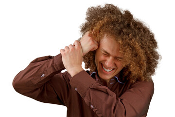 A long-haired curly-haired guy in a brown shirt on a white background uses a wooden comb. Emotions...