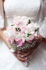 Wedding bouquet in brides hands