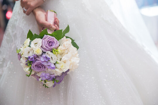 Wedding bouquet in brides hands