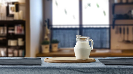 Fresh cold milk and window in home interior 