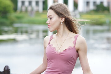 Portrait of a young beautiful girl in the park