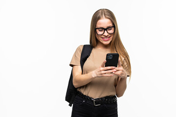 Fototapeta premium Young beautiful student woman with phone and coffee with backpack isolated on white background