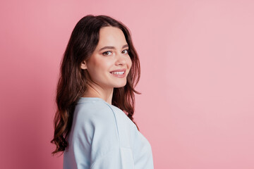Fototapeta premium Lovely charming young girl posing look camera beaming white smile isolated on pink background