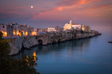 Scenic view of Vieste with the church of San Francesco at sunset, Gargano, Puglia, Italy