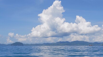 Fototapeta na wymiar Exotic scenery islands with cloudscape and calm waters of Andaman sea in Krabi Province, Thailand.