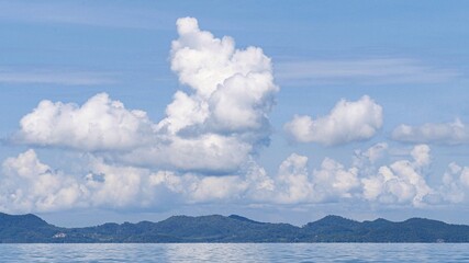 Exotic scenery islands with cloudscape and calm waters of Andaman sea in Krabi Province, Thailand.
