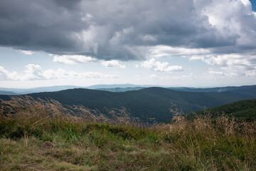 	
Panorama of mountain peaks on a cloudy, windy day, Bieszczady Mountains, Poland