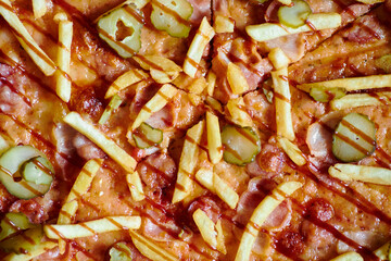 pizza with fries on a black background