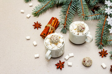 Fototapeta na wymiar Christmas poster template composition with mugs of hot chocolate, marshmallows and fir tree branches