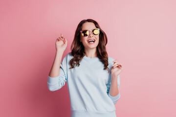 Funny gorgeous stylish lady wear sunglass have fun open mouth careless mood on pink wall
