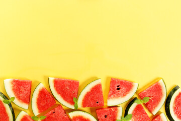 Sliced watermelon on yellow background, top view