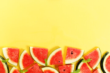 Fototapeta na wymiar Sliced watermelon on yellow background, top view