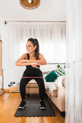young happy woman exercising at home