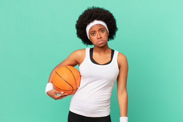 afro woman feeling sad and whiney with an unhappy look, crying with a negative and frustrated...