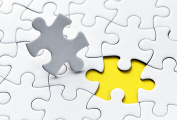 Fototapeta premium Assembling jigsaw puzzle pieces. Abstract background.