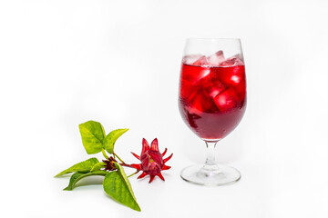 Fresh Roselle flower ( Jamaica sorrel, Rozelle or hibiscus sabdariffa ) and glass of sorrel juice ice tea isolated on white background.