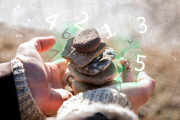 Hands stones and numbers, numerology
