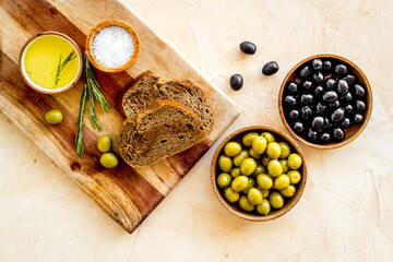 Fototapeta na wymiar Italian food with olives bread and olive oil. Overhead view