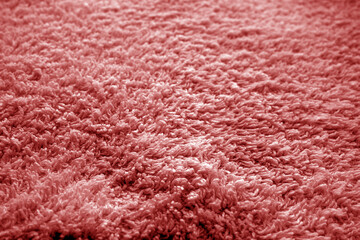 Bath towel texture with blur effect in red color.