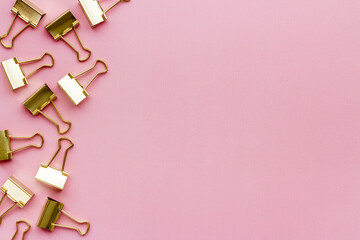 Office supplies background - paper binder clips top view