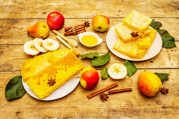 Autumn composition with fresh apples, pears, honeycombs and fragrant spices