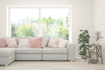 White living room with sofa and summer landscape in window. Scandinavian interior design. 3D illustration