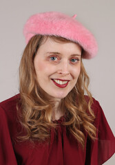 Girl with pink fluffy hat