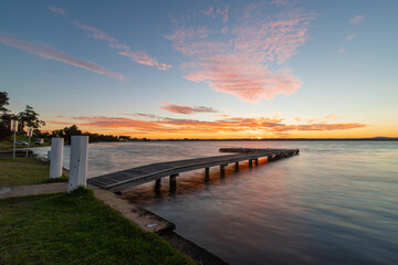 Fototapeta na wymiar Sunset view of the jetty in the lake.