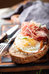 Breakfast sandwich. Scrambled eggs and jamon on whole grain bread