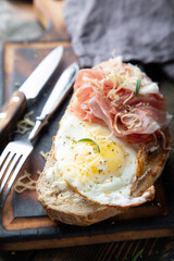 Breakfast sandwich. Scrambled eggs and jamon on whole grain bread