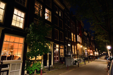 Night in Amsterdam, bikes and streets in the light of street lamps. Night. Summer.