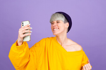 Excited young woman amazed by unbelievable shopping mobile app sale message looking at smartphone, girl winner holding cell phone screaming with joy