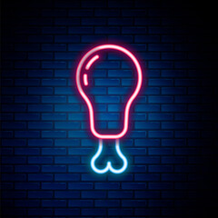 Glowing neon line Chicken leg icon isolated on brick wall background. Chicken drumstick. Colorful outline concept. Vector