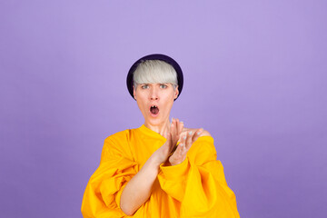 Stylish european woman on purple background clapping and applauding happy and joyful, smiling proud hands together