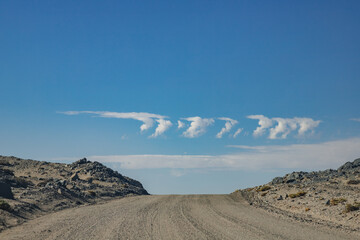 clouds in the form of the number seven on Cape Dias near the city of Luderitz Namibia