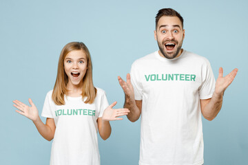 Two young friends couple teen girl man wears white t-shirt green title volunteer looking camera...
