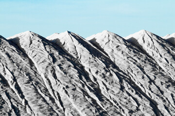 Salt mountains under blue sky in Spain