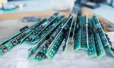 Close-up panel with numbered round buttons and inputs with plugs next to antennas at a secret...