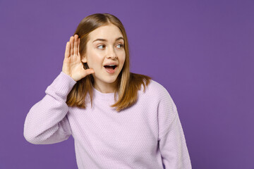 Young curious nosy happy caucasian woman 20s wearing purple knitted sweater try to hear you...