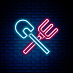 Glowing neon line Shovel and rake icon isolated on brick wall background. Tool for horticulture, agriculture, gardening, farming. Ground cultivator. Colorful outline concept. Vector
