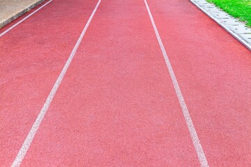 Fototapeta premium Red rubber running track flooring texture and background